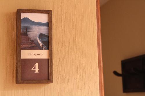 a picture on a door with a number four on it at 7 orejas in Quetzaltenango