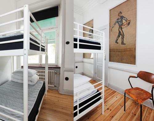 a room with two bunk beds and a desk at City Backpackers Hostel in Stockholm