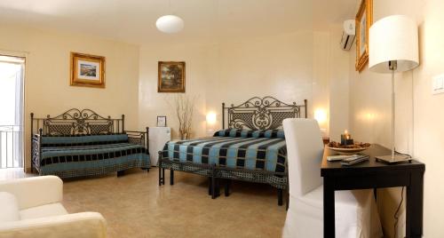 En eller flere senge i et værelse på Dimora Storica ''Casa Sicuro''