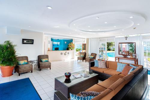 a living room with a couch and chairs at Bay Gardens Marina Haven in Gros Islet