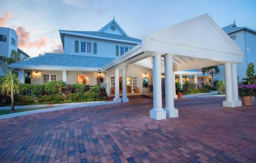 a large white house with a brick driveway at Bay Gardens Beach Resort & Spa in Gros Islet