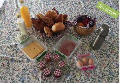 a table with a bunch of food on it at Chalet de la Joncquière in Villers-la-Ville