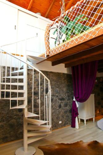 a spiral staircase in a room with a ceiling at Villa with Ocean View in Agulo