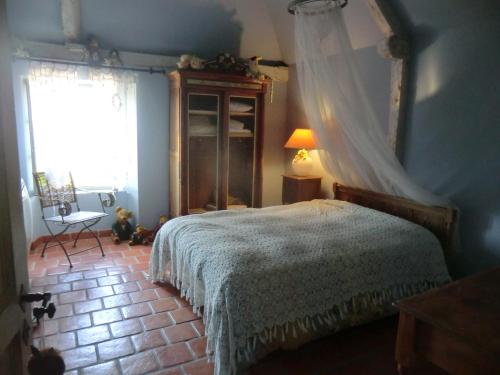 Postel nebo postele na pokoji v ubytování Les Hortensias