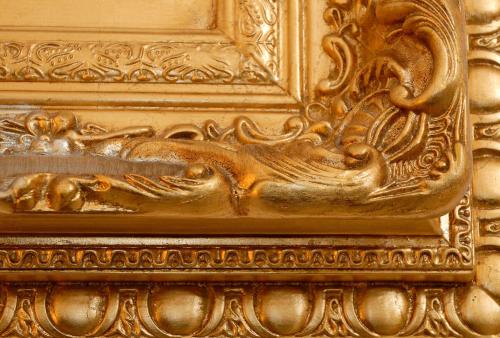 a gold door with a carving of a horse on it at Dimora Storica ''Casa Sicuro'' in Martano