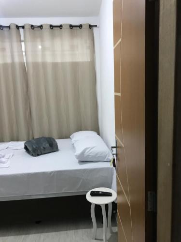 Ένα ή περισσότερα κρεβάτια σε δωμάτιο στο Pousada Anjos da Montanha