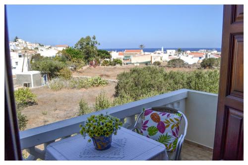 a table and chair on a balcony with a view at Blue Sky in Frý