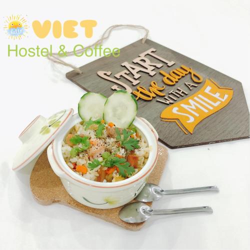 a bowl of food with vegetables and cucumbers on a napkin at VIỆT Hostel in Hue