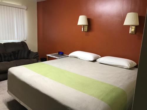 Postel nebo postele na pokoji v ubytování Motel Grand