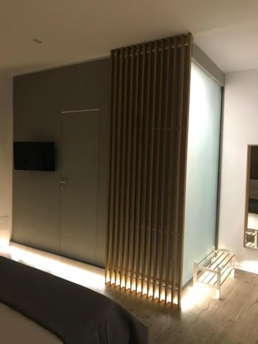 a bedroom with a large window with a radiator at Le Dimore Degli Archi Catania in Catania