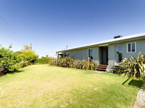 a house with a yard in front of it at Do Drop Inn - Port Willunga - C21 SouthCoast Holidays in Port Willunga