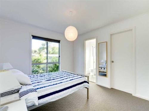 Katil atau katil-katil dalam bilik di Do Drop Inn - Port Willunga - C21 SouthCoast Holidays
