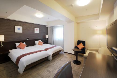 Cama ou camas em um quarto em Richmond Hotel Sendai