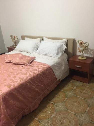 מיטה או מיטות בחדר ב-Casa Vacanza puntello