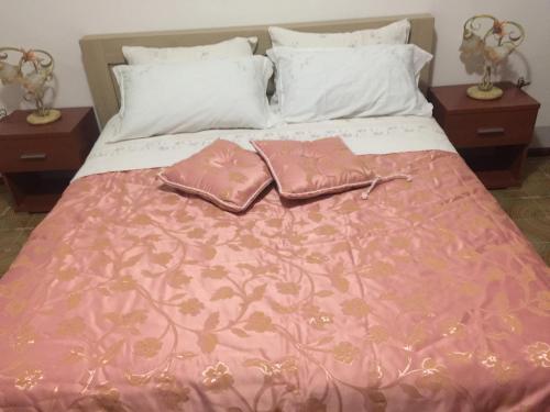 מיטה או מיטות בחדר ב-Casa Vacanza puntello