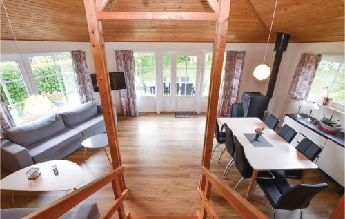 a living room with a couch and a table at Two-Bedroom Holiday Home In Broager in Broager