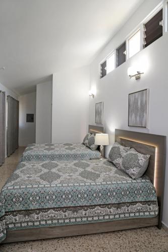 Cama o camas de una habitación en Itza-Bella Suites