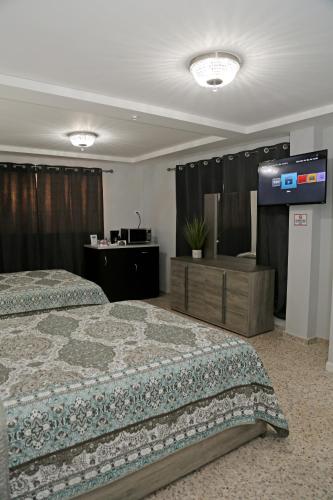 Cama o camas de una habitación en Itza-Bella Suites