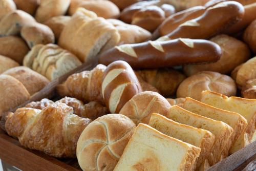 a bunch of different types of breads and pastries at Grand Inn Higashi-Okazaki in Okazaki