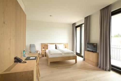 Ένα ή περισσότερα κρεβάτια σε δωμάτιο στο Hotel Kloster Haydau