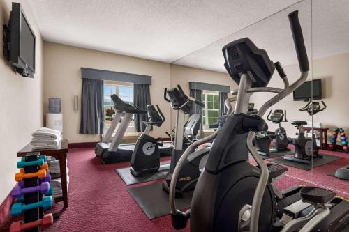 a fitness room with treadmills and exercise bikes at Ramada by Wyndham Pigeon Forge North in Pigeon Forge