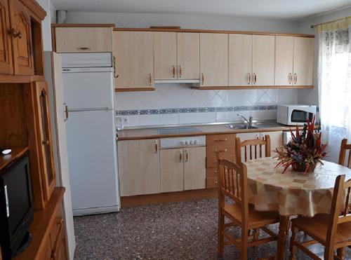 Кухня или кухненски бокс в Apartamentos Herranz