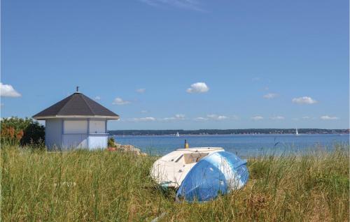 a boat sitting in the grass next to a building at Studio Apartment In Helsingor in Helsingør