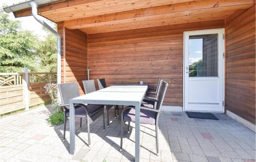 a white table and chairs on a patio at Four-Bedroom Holiday Home In Middelfart in Middelfart