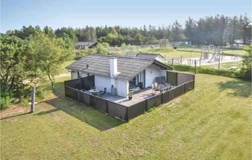 an overhead view of a small house in a field at Holiday Home Sivvejen in Nørre Nebel