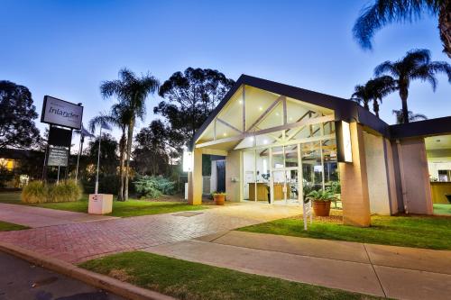 a building with a sign in front of it at Mildura Inlander Resort in Mildura