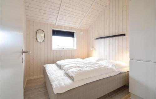 a white bed in a room with a window at Four-Bedroom Holiday Home In Malling in Malling