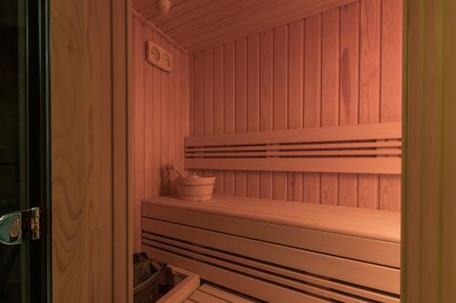 a sauna with a potted plant sitting on a shelf at GARNI HOTEL AMI in Novi Sad