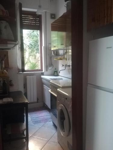 a kitchen with a washing machine and a dishwasher at Home Caviglia CITRA 09029-LT-0618 in Finale Ligure