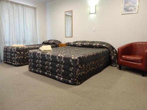 Ένα ή περισσότερα κρεβάτια σε δωμάτιο στο Bealey Avenue Motel