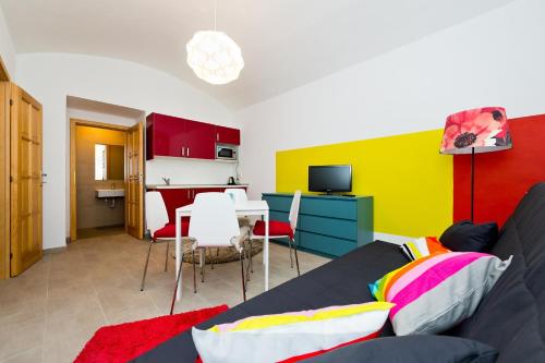 a living room with a couch and a table at Budget Apartment in Prague