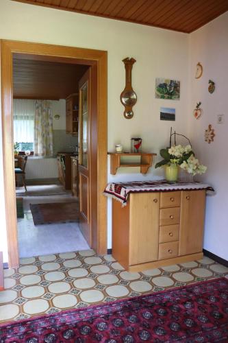 a room with a kitchen with a counter and a room at Ferienhaus Aurelia in Kitzeck im Sausal