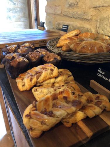 a bunch of pastries and other baked goods on display at Borgo Castello Panicaglia in Nocera Umbra