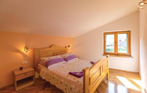 Postel nebo postele na pokoji v ubytování Vacation apartments Feniks