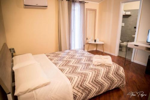Postel nebo postele na pokoji v ubytování Hotel Lonatino