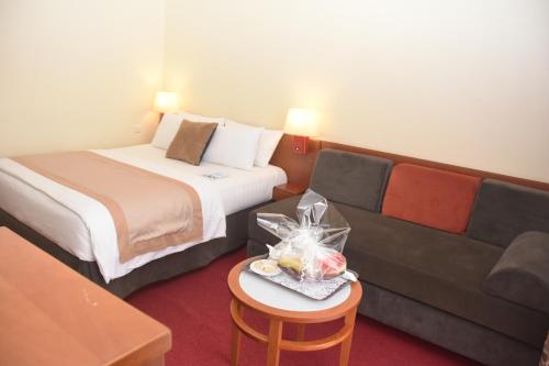 Un ou plusieurs lits dans un hébergement de l'établissement Hôtel Sawa