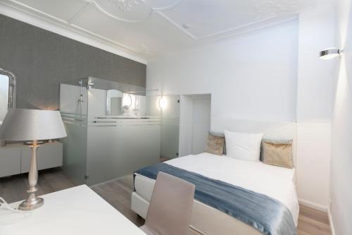 Ein Bett oder Betten in einem Zimmer der Unterkunft Hotel Prinz Anton