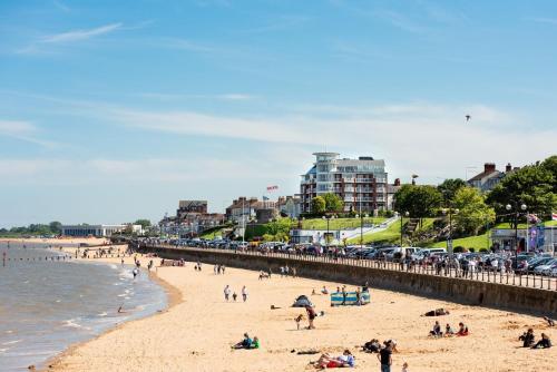a group of people on a beach near the water at The Bays Clee Rd in Cleethorpes