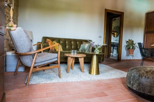a living room with a couch and a table at Borgo Castello Panicaglia in Nocera Umbra