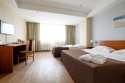 מיטה או מיטות בחדר ב-Atlantic by USTA Hotels