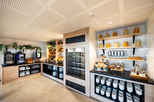 a store filled with lots of differentiatesiatesiatesiatesiatesiatesiatesiatesiates at Staycity Aparthotels near Disneyland Paris in Bailly-Romainvilliers