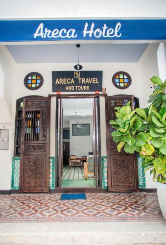 an areaica hotel with a sign above the doors at Areca Hotel Penang in George Town