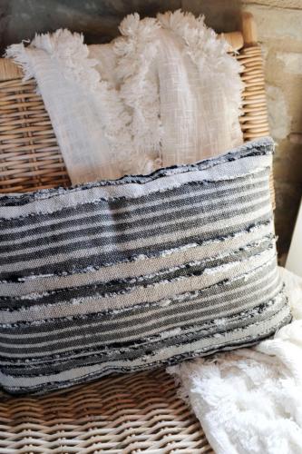 a wicker basket with a black and white striped towel at Borgo Castello Panicaglia in Nocera Umbra