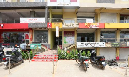 a group of motorcycles parked in front of a building at Treebo The Galaxy Bommasandra in Bengaluru