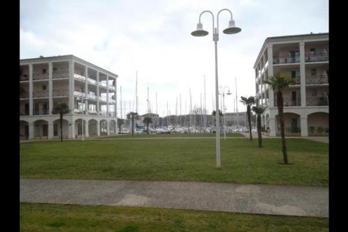 a park with a building and a street light at appartement "Helios" touristes et curistes annonce d'un particulier in Rochefort