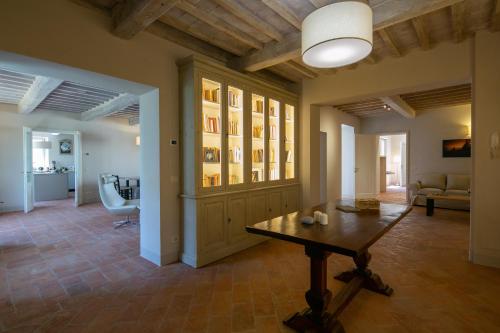 a living room with a table and a couch at Villa Severina in Cortona